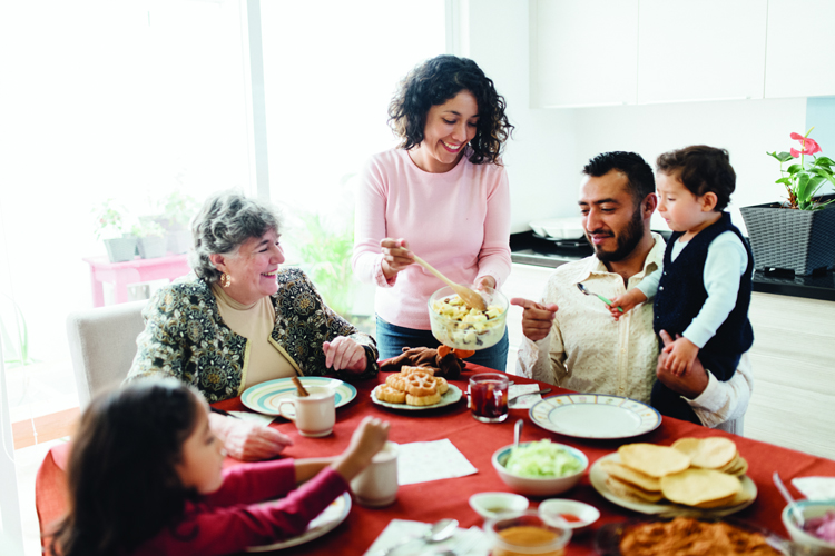 Family eating a meal together at the table