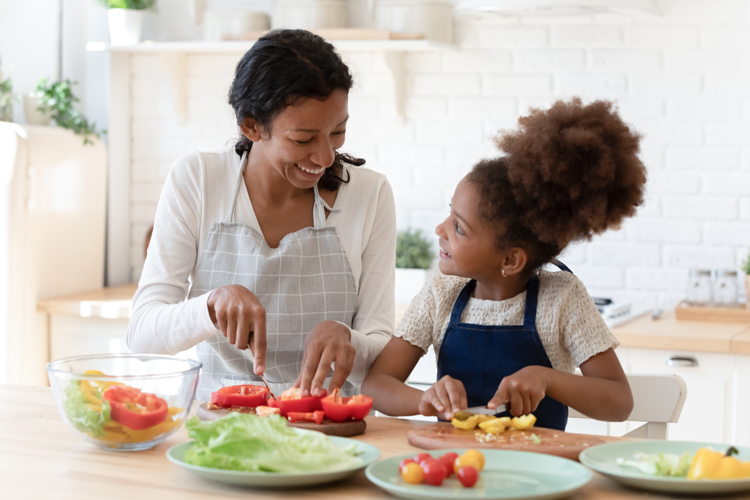 Parent and child preparing healthy food