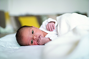Infant lying on back and looking up