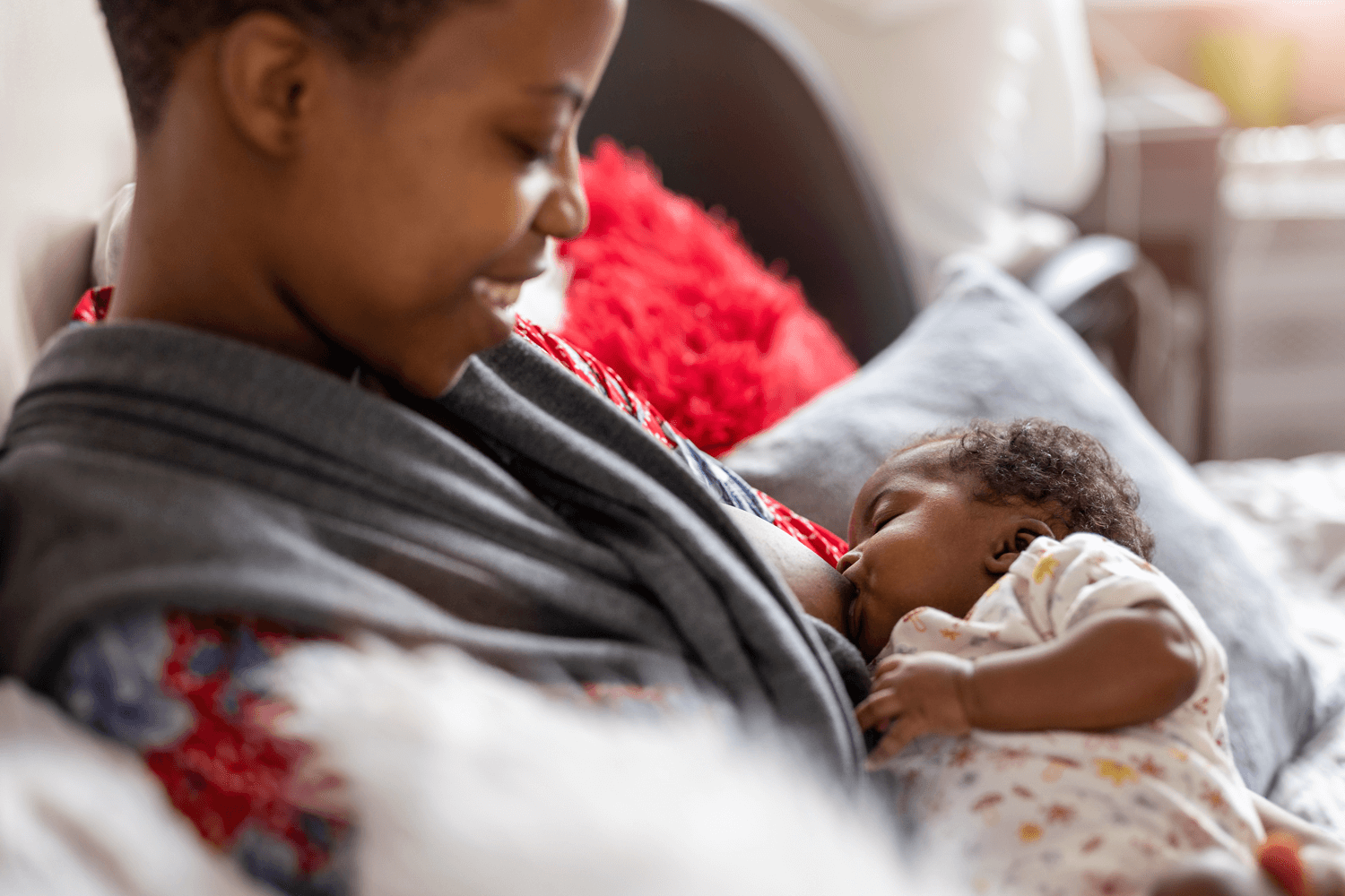 Parent breastfeeding a newborn