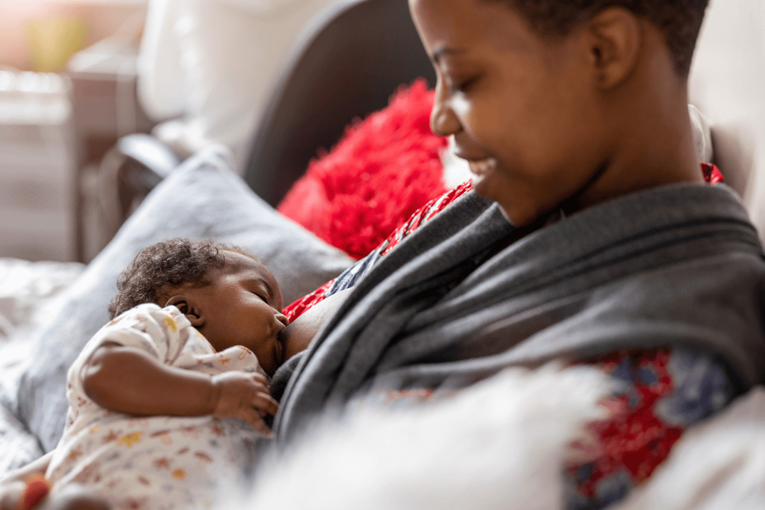 Parent breastfeeding a newborn