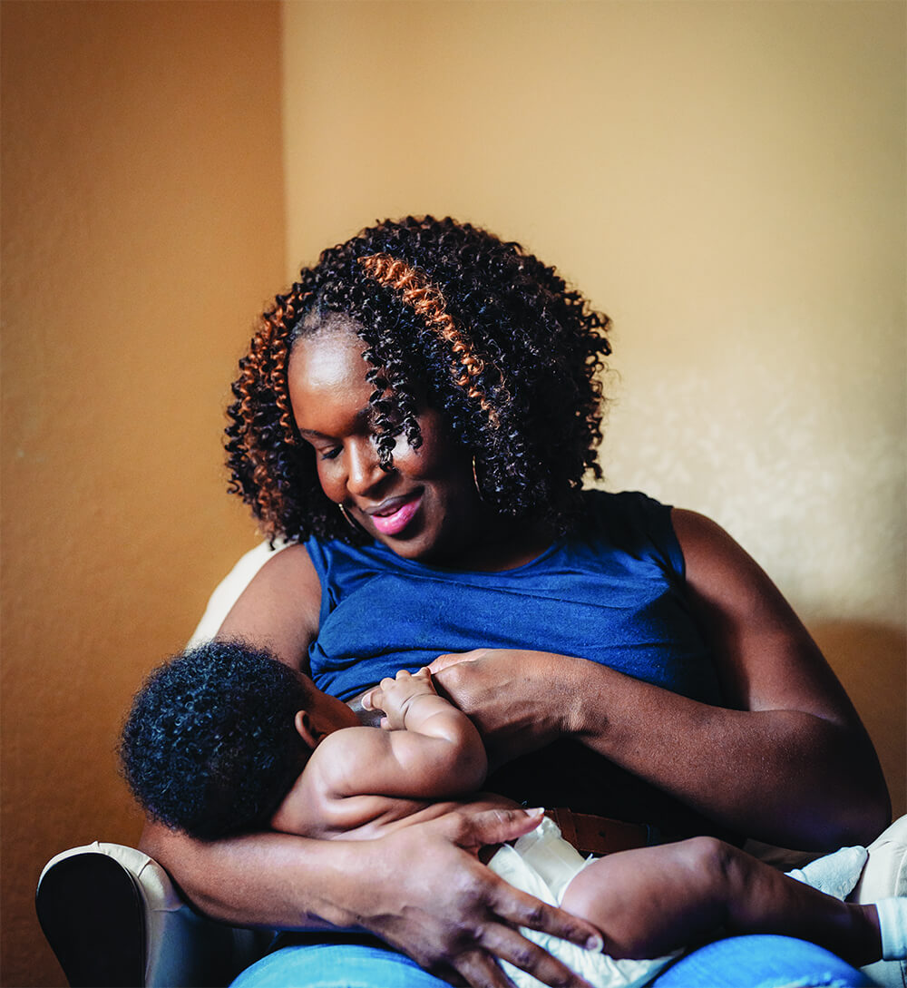 Parent breastfeeding a baby