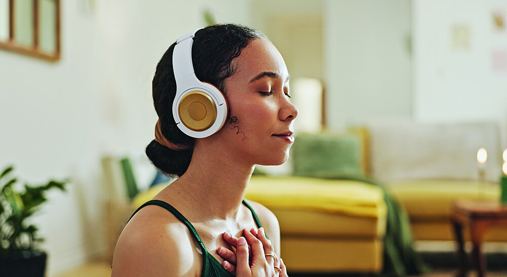Woman meditating with headphones